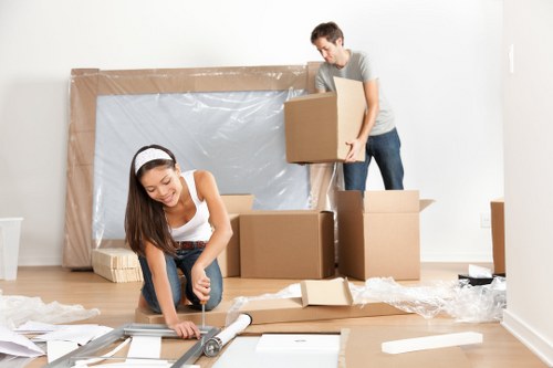 Local movers handling a flat move with stairs and narrow access