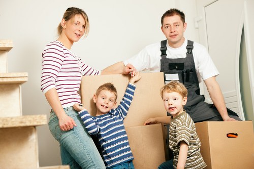 Packed boxes and wrapped furniture prepared for house removals in Colliers Wood