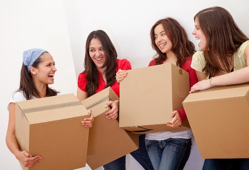 Moving van loading household items for a Colliers Wood relocation