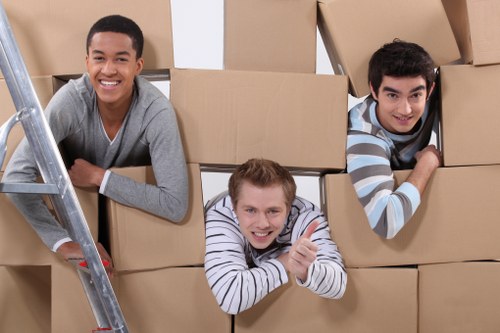 Loading furniture into a moving truck near Colliers Wood