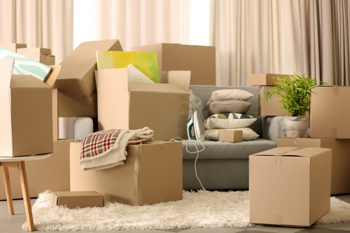 Professional movers moving bedroom furniture in a Colliers Wood flat