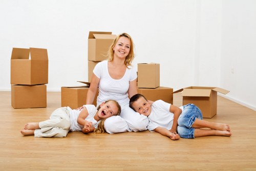 Professional movers loading boxes and furniture for a local relocation