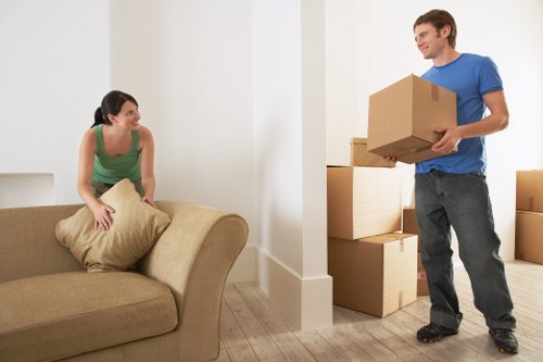 Local moving team loading furniture into a van in Colliers Wood